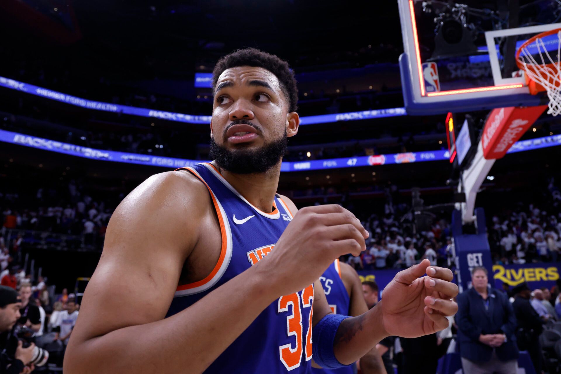 May 1, 2025; Detroit, Michigan, USA; New York Knicks center Karl-Anthony Towns (32) walks off the court after the game against the Detroit Pistons during game six of first round for the 2024 NBA Playoffs at Little Caesars Arena. Mandatory Credit: Rick Osentoski-Imagn Images