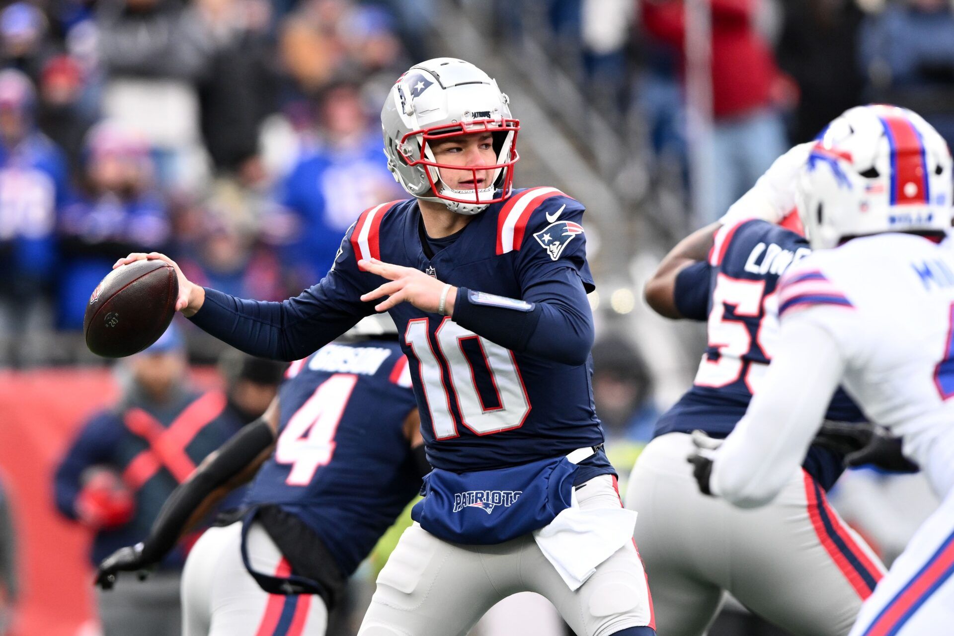 Jan 5, 2025; Foxborough, Massachusetts, USA; New England Patriots quarterback Drake Maye (10) looks to throw against the Buffalo Bills during the first half at Gillette Stadium. Mandatory Credit: Brian Fluharty-Imagn Images