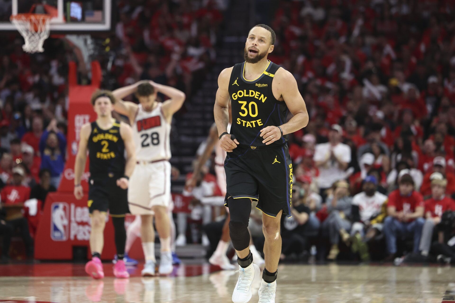 Golden State Warriors guard Stephen Curry (30) reacts after scoring a basket during the second half of game seven of the first round for the 2025 NBA Playoffs against the Houston Rockets at Toyota Center.