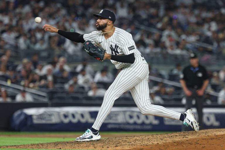 New York Yankees relief pitcher Devin Williams (38) delivers a pitch during the eighth inning against the Tampa Bay Rays at Yankee Stadium.