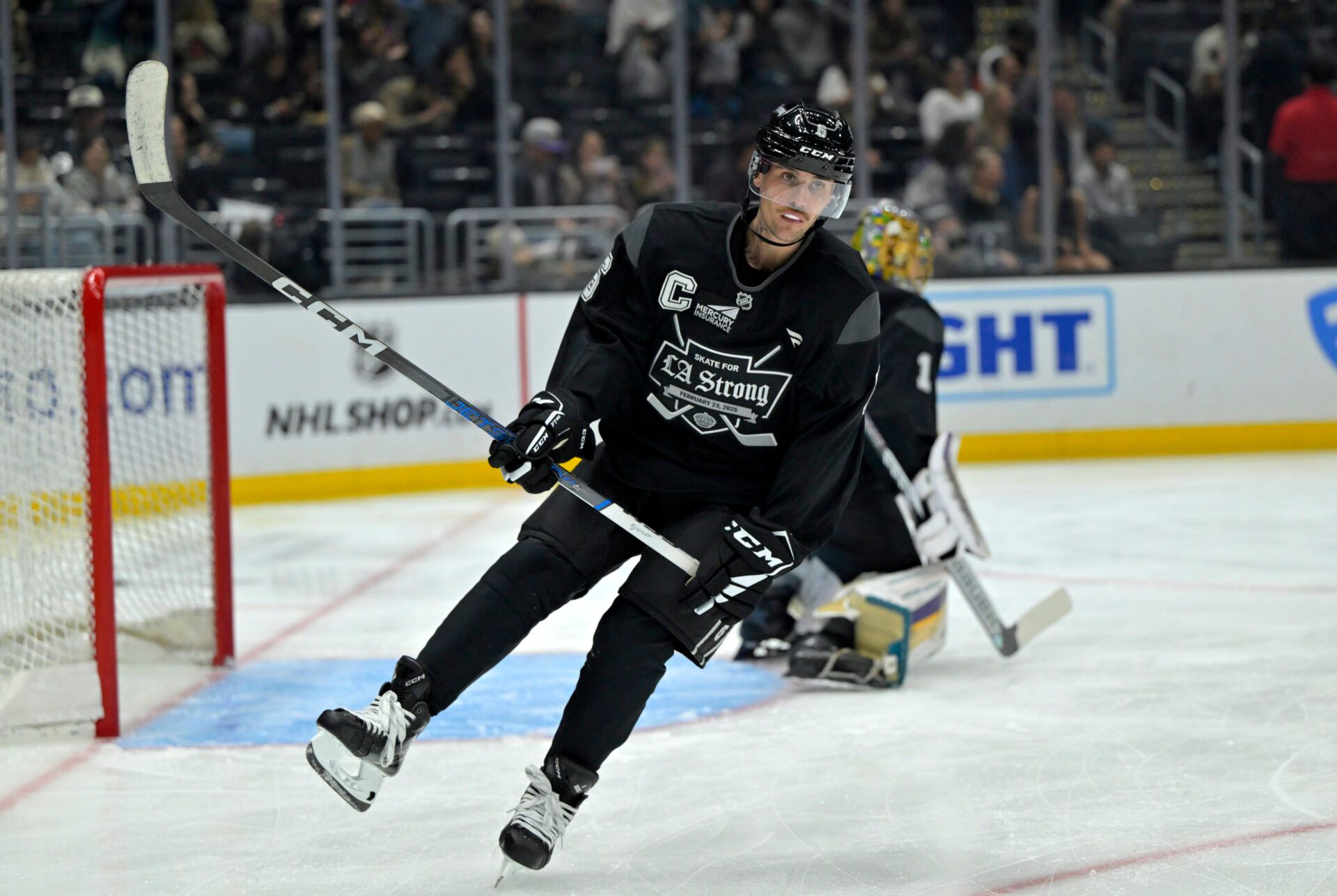 Feb 23, 2025; Los Angeles, CA, USA; Canadian singer Justin Bieber skates on the ice during the Los Angeles Kings Celebrity Charity Game for LA Wildfire Relief at Crypto.com Arena. teams. Mandatory Credit: Jayne Kamin-Oncea-Imagn Images