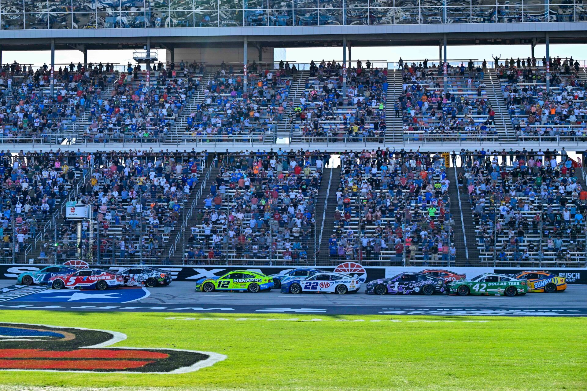 Dallas Cowboys quarterback and his teammates huddled along to Texas Motor Speedway for some NASCAR action in their own backyard.
