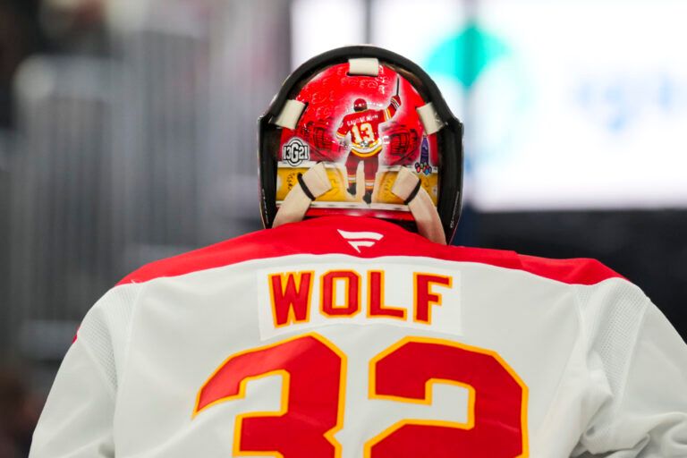 Nov 29, 2024; Columbus, Ohio, USA; Calgary Flames goaltender Dustin Wolf (32) wears a tribute to the late Johnny Gaudreau on his helmet in the game against the Columbus Blue Jackets in the second period at Nationwide Arena. Mandatory Credit: Aaron Doster-Imagn Images