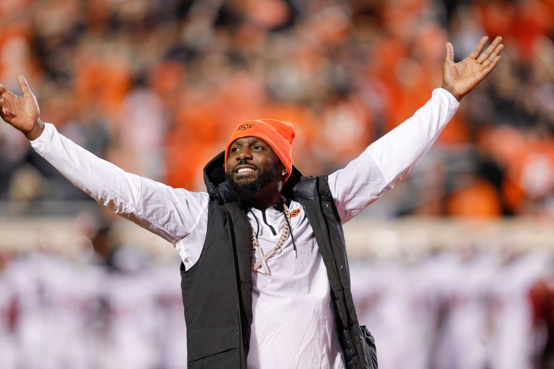 Nov 27, 2021; Stillwater, Oklahoma, USA; Oklahoma State Cowboys former receiver Dez Bryant waves to the fans during the first half of a game against the Oklahoma Sooners at Boone Pickens Stadium. Mandatory Credit: Alonzo Adams-USA TODAY Sports