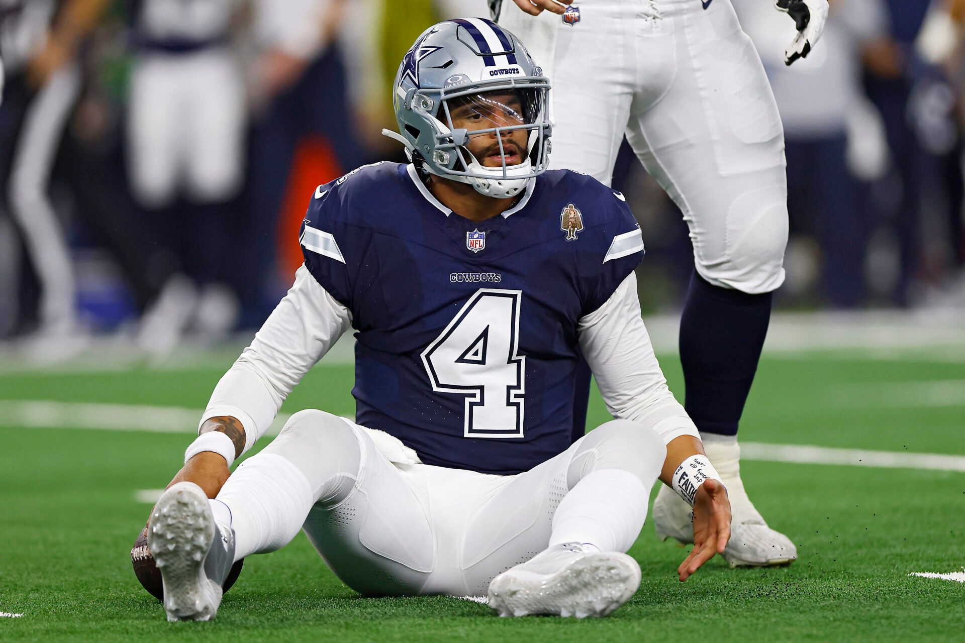 ARLINGTON, TEXAS - OCTOBER 29: Dak Prescott #4 of the Dallas Cowboys reacts after getting sacked in the first quarter of a game against the Los Angeles Rams at AT&T Stadium on October 29, 2023 in Arlington, Texas. (Photo by Ron Jenkins/Getty Images)