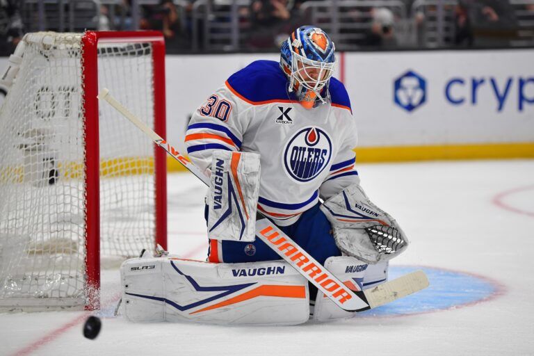 Apr 29, 2025; Los Angeles, California, USA; Edmonton Oilers goaltender Calvin Pickard (30) blocks a shot against the Los Angeles Kings during the second period in game five of the first round of the 2025 Stanley Cup Playoffs at Crypto.com Arena. Mandatory Credit: Gary A. Vasquez-Imagn Images
