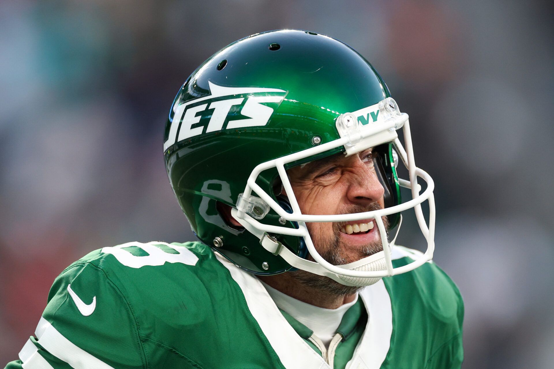 EAST RUTHERFORD, NEW JERSEY - JANUARY 05: Aaron Rodgers #8 of the New York Jets reacts after throwing an interception against the Miami Dolphins during the first quarter at MetLife Stadium on January 05, 2025 in East Rutherford, New Jersey. (Photo by Luke Hales/Getty Images)