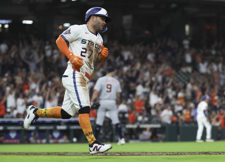 Detroit Tigers starting pitcher Jack Flaherty (9) looks up and Houston Astros left fielder Jose Altuve (27) rounds the bases after hitting a home run during the sixth inning at Daikin Park.