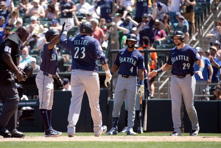 Seattle Mariners first baseman Rowdy Tellez (23) is greeted by his teammates after hitting a three-run home run against the Athletics during the sixth inning at Sutter Health Park.