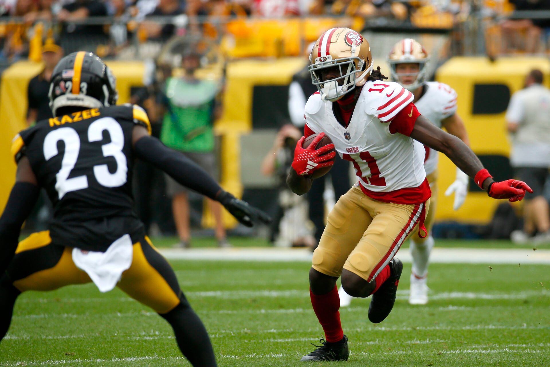 PITTSBURGH, PENNSYLVANIA - SEPTEMBER 10: Brandon Aiyuk #11 of the San Francisco 49ers runs up the field against Damontae Kazee #23 of the Pittsburgh Steelers in the first half of a game at Acrisure Stadium on September 10, 2023 in Pittsburgh, Pennsylvania. (Photo by Justin K. Aller/Getty Images)