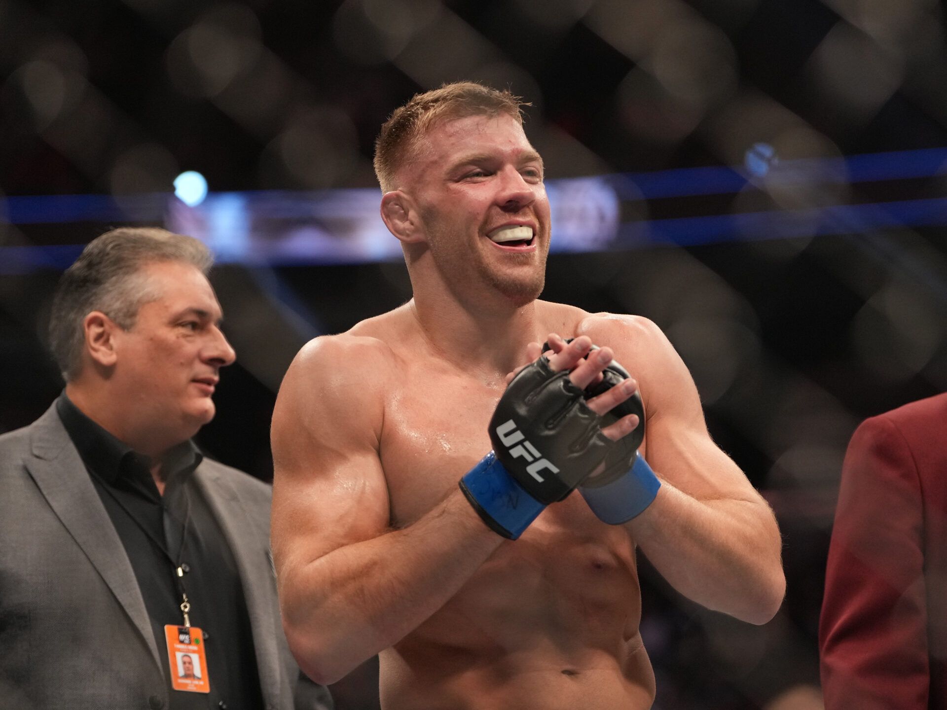 Dec 10, 2022; Las Vegas, Nevada, USA; Dricus Du Plessis (blue gloves) reacts after fighting Darren Till (red gloves) during UFC 282 at T-Mobile Arena. Mandatory Credit: Stephen R. Sylvanie-USA TODAY Sports
