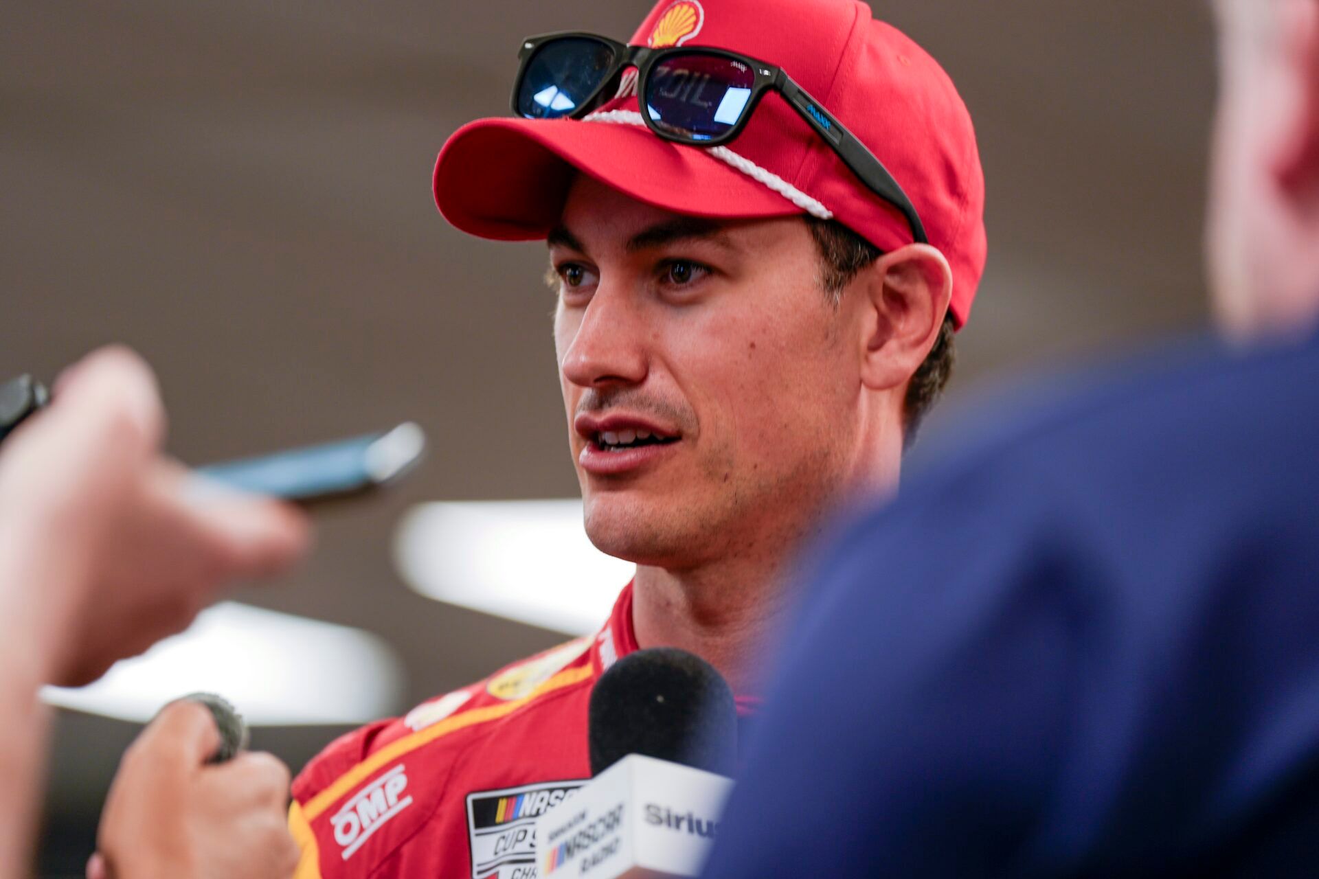 Apr 5, 2025; Darlington, South Carolina, USA; NASCAR Cup Series driver Joey Logano (22) talks with media at Darlington Raceway. Mandatory Credit: Jim Dedmon-Imagn Images