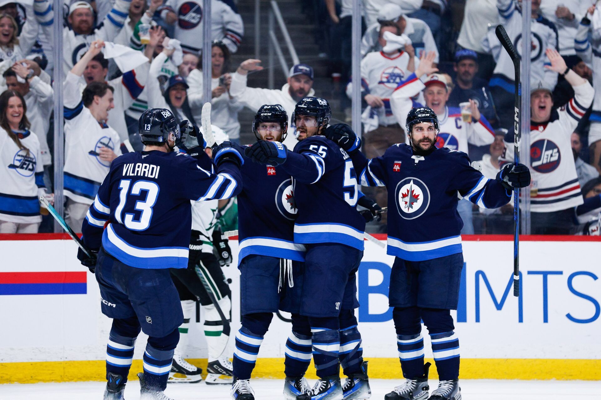 Winnipeg Jets forward Mark Scheifele (55) is congratulated by his team mates on his goal against the Dallas Stars during the second period in game one of the second round of the 2025 Stanley Cup Playoffs at Canada Life Centre.