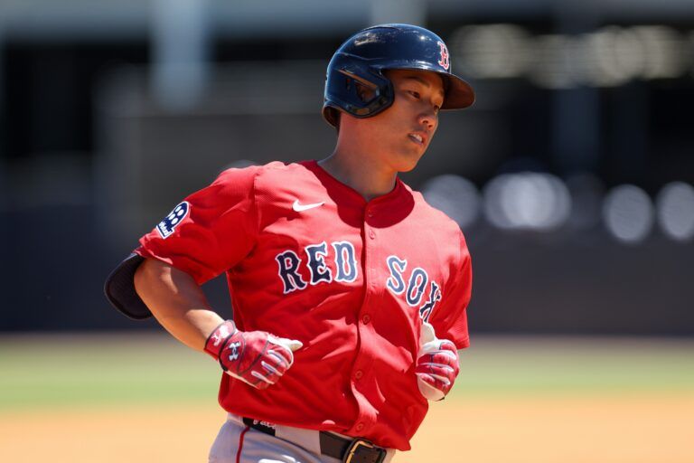 Boston Red Sox outfielder Masataka Yoshida (7) runs the bases after hitting a two run home run against the New York Yankees in the sixth inning during spring training at George M. Steinbrenner Field.