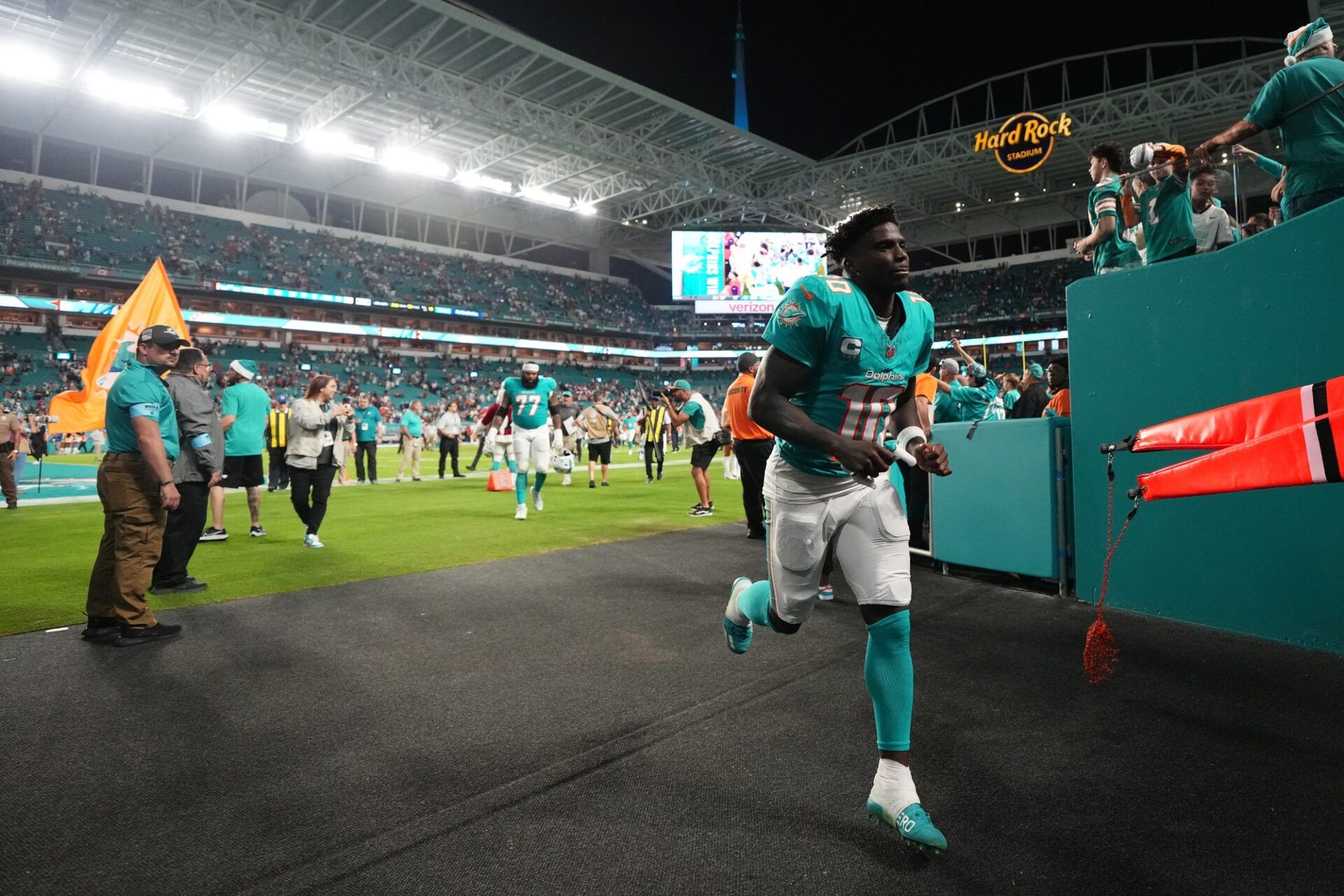 Dec 22, 2024; Miami Gardens, Florida, USA; Miami Dolphins wide receiver Tyreek Hill (10) runs off the field after defeating the San Francisco 49ers at Hard Rock Stadium. Mandatory Credit: Jasen Vinlove-Imagn Images