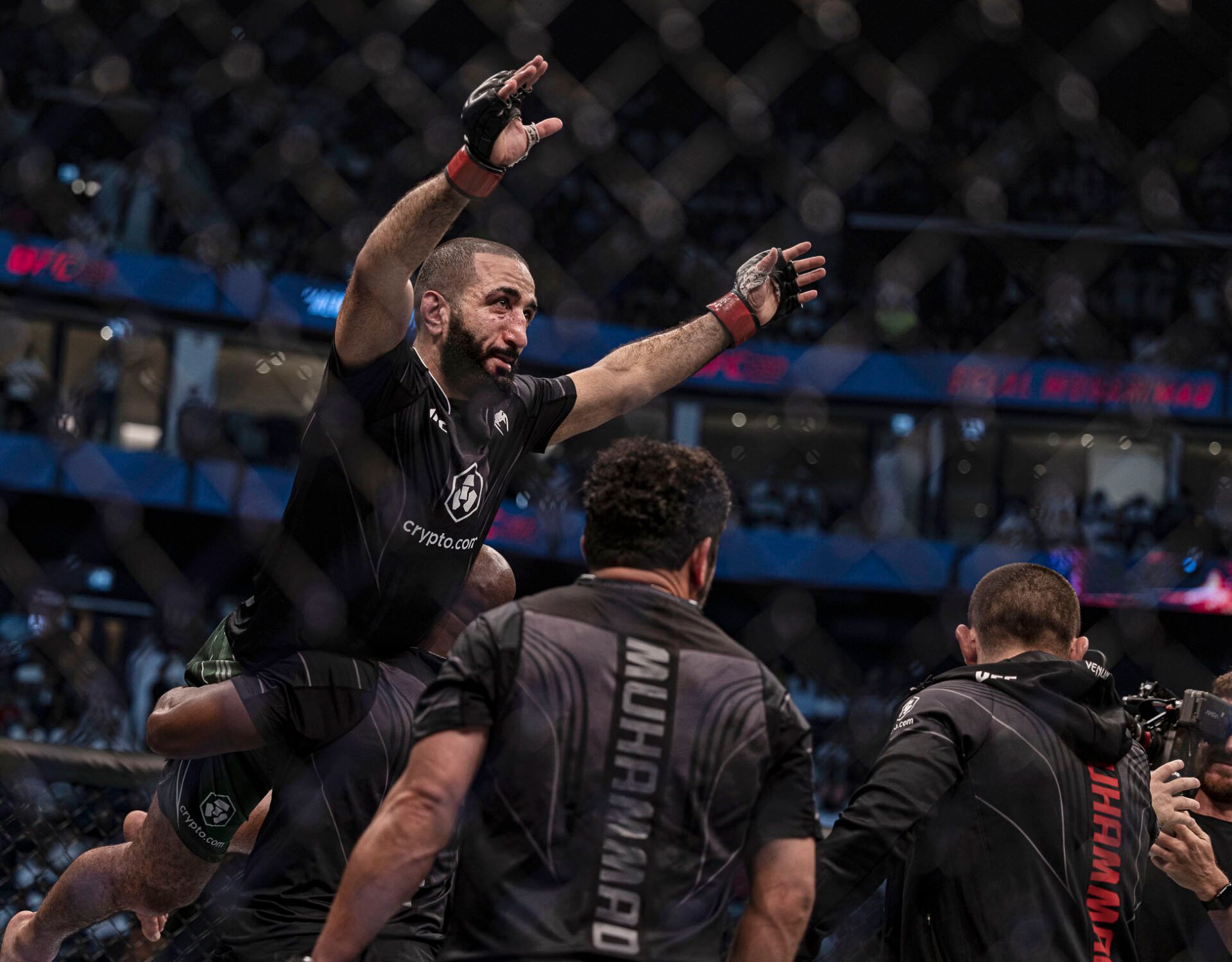 Oct 22, 2022; Abu Dhabi, UAE; Belal Muhammad (red gloves) defeats Sean Brady (blue gloves) during UFC 280 at Etihad Arena. Mandatory Credit: Craig Kidwell-USA TODAY Sports
