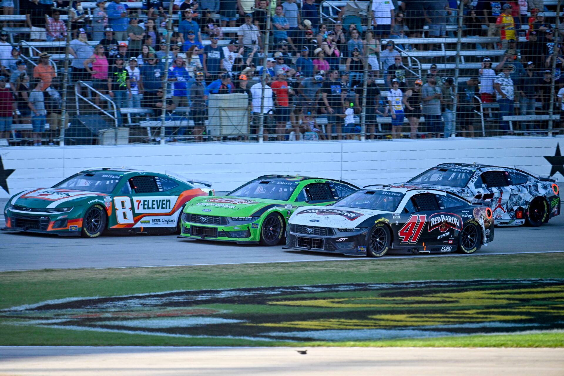 May 4, 2025; Fort Worth, Texas, USA; NASCAR Cup Series driver Kyle Busch (8) and driver Zane Smith (38) and driver Cole Custer (41) drives during the Wurth 400 race at Texas Motor Speedway. Mandatory Credit: Jerome Miron-Imagn Images