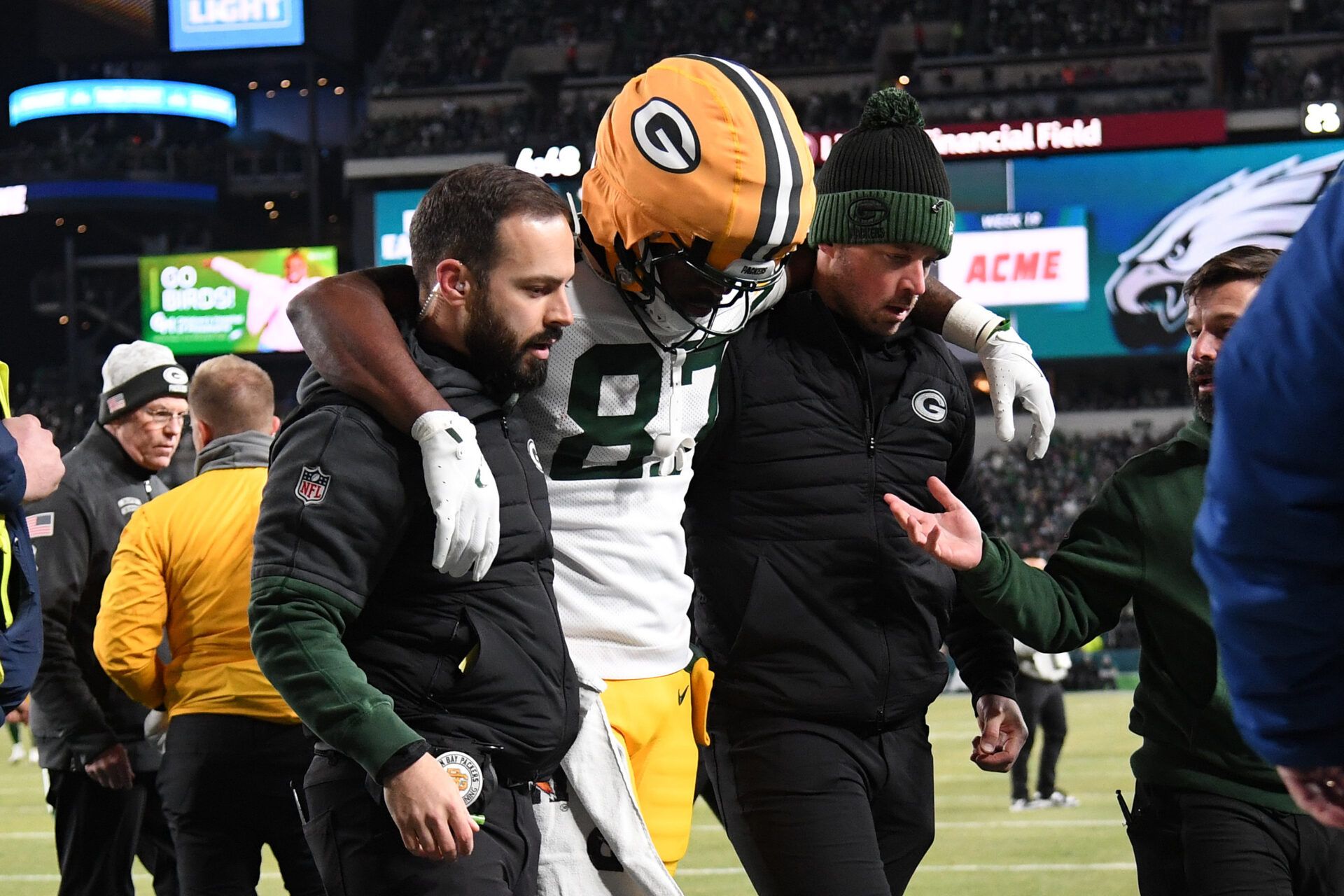 Jan 12, 2025; Philadelphia, Pennsylvania, USA; Green Bay Packers wide receiver Romeo Doubs (87) is helped off the field after being injured against the Philadelphia Eagles in an NFC wild card game at Lincoln Financial Field. Mandatory Credit: Eric Hartline-Imagn Images