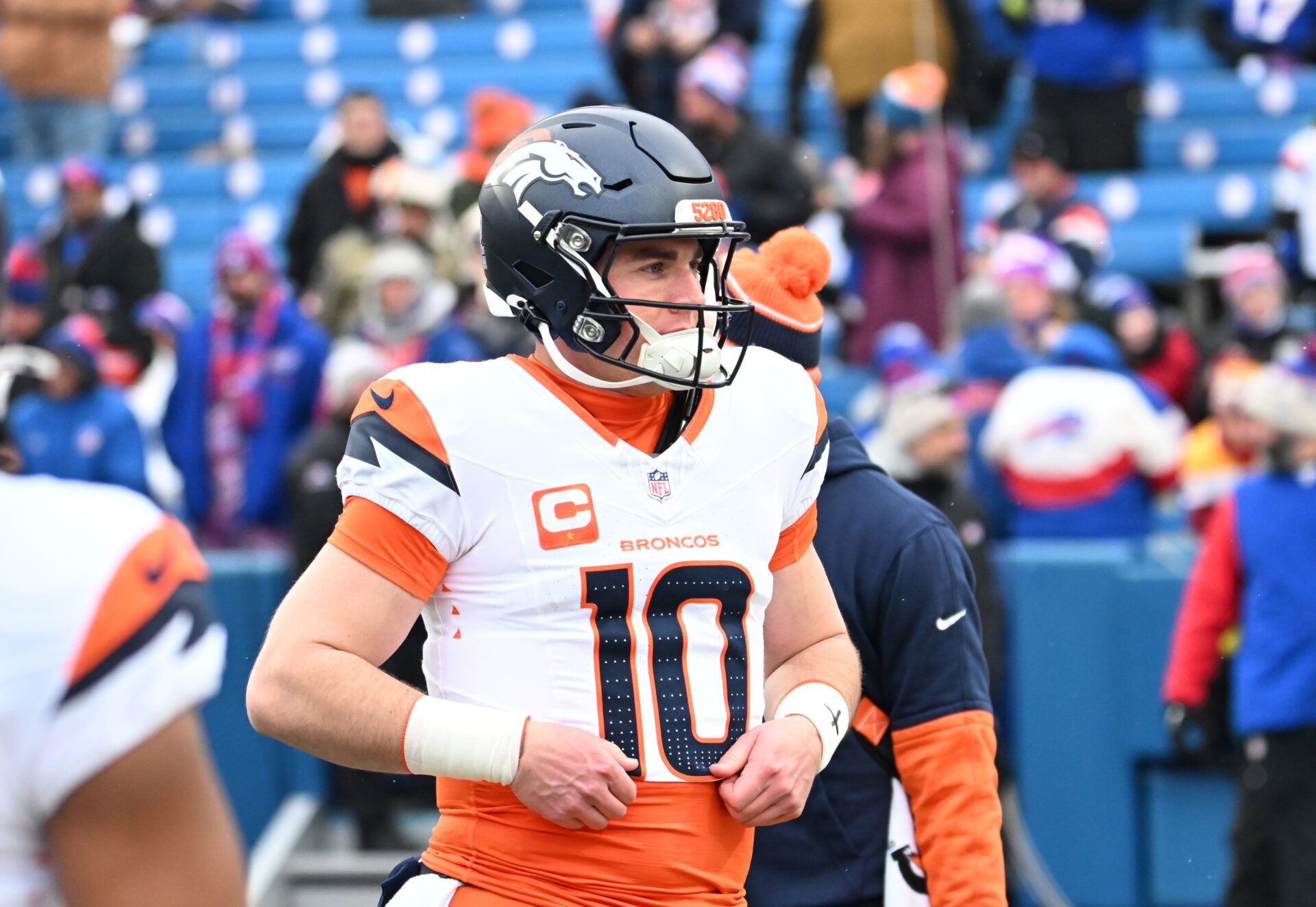 Jan 12, 2025; Orchard Park, New York, USA; Denver Broncos quarterback Bo Nix (10) warms up before a game against the Buffalo Bills in an AFC wild card game at Highmark Stadium. Mandatory Credit: Mark Konezny-Imagn Images