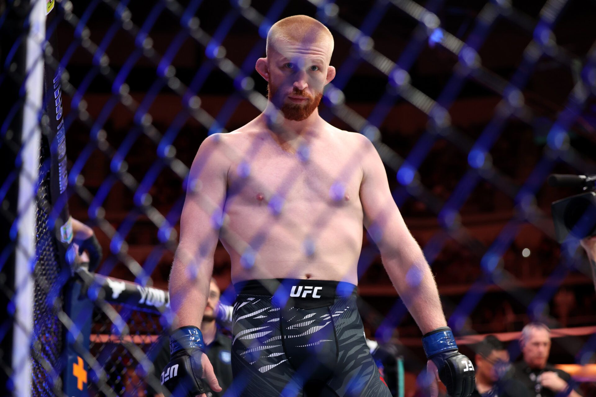 May 3, 2025; Des Moines, Iowa, UNITED STATES; Bo Nickal (blue gloves) prepares to fight Reinier de Ridder (not pictured) during UFC Fight Night at Wells Fargo Arena. Mandatory Credit: Reese Strickland-Imagn Images
