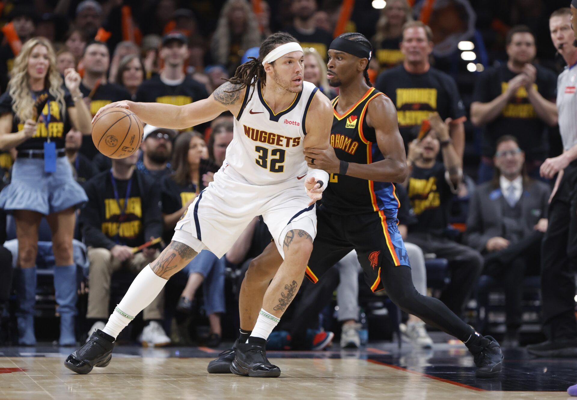 Denver Nuggets forward Aaron Gordon (32) drives against Oklahoma City Thunder guard Shai Gilgeous-Alexander (2) in the second half during game two of the second round for the 2025 NBA Playoffs at Paycom Center.