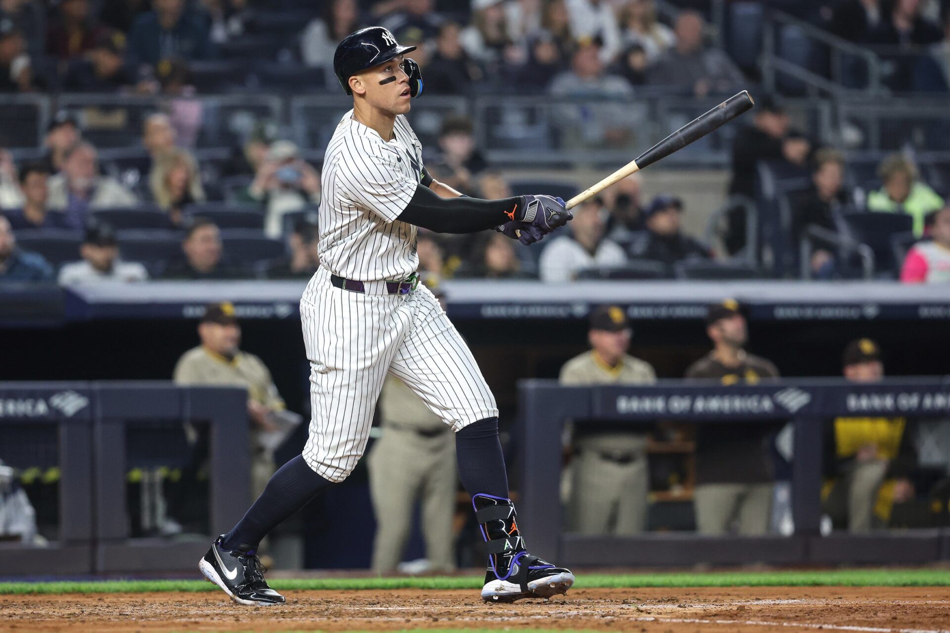 New York Yankees right fielder Aaron Judge (99) hits a solo home run in the fourth inning against the San Diego Padres at Yankee Stadium.