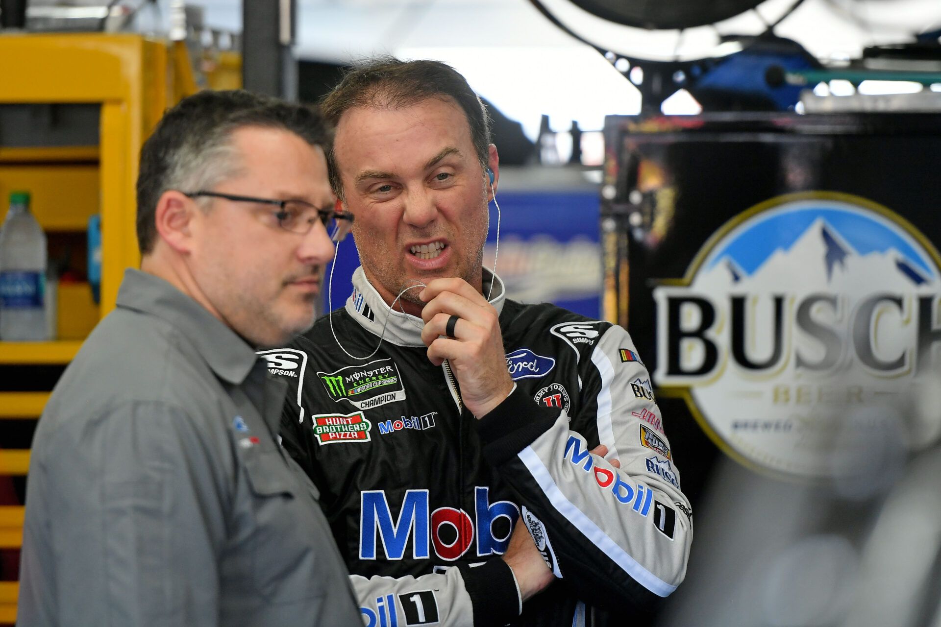 May 23, 2019; Concord, NC, USA; NASCAR Cup Series car owner Tony Stewart (L) talks with his driver Kevin Harvick (R) in the garage during practice for the Coca-cola 600 at Charlotte Motor Speedway. Mandatory Credit: Jasen Vinlove-USA TODAY Sports