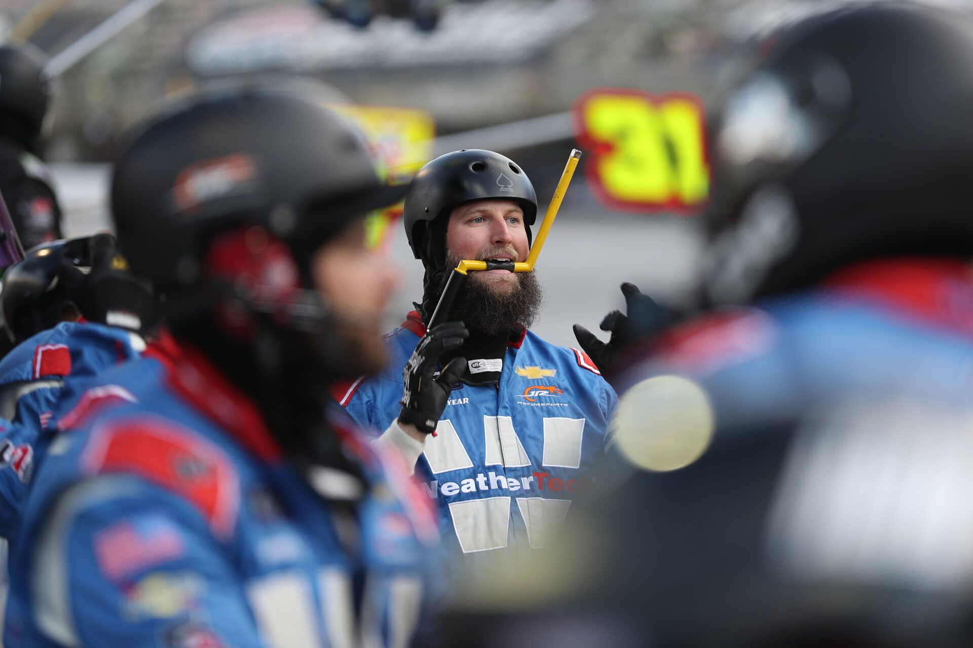 A crew member for NASCAR Xfinity Series driver Connor Zilisch (88) gets ready for a pit stop during the NASCAR SciAps 300 at Bristol Motor Speedway.