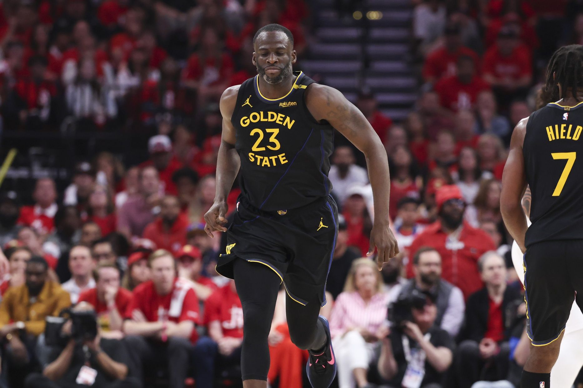 Golden State Warriors forward Draymond Green (23) reacts after scoring a basket during the third quarter of game seven of the first round for the 2025 NBA Playoffs against the Houston Rockets at Toyota Center.