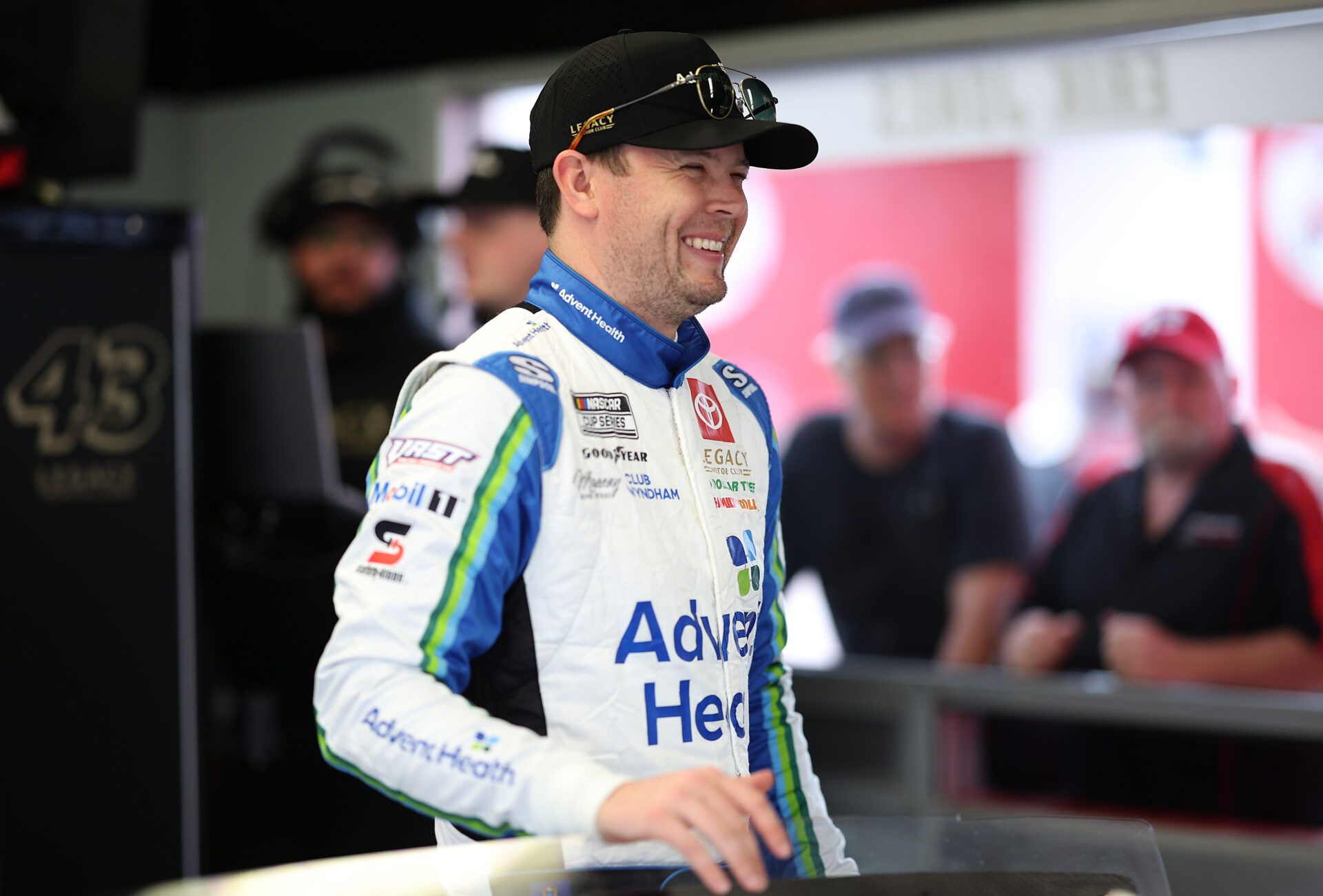DAYTONA BEACH, FLORIDA - FEBRUARY 14: Erik Jones, driver of the #43 AdventHealth Toyota laughs in the garage area during practice for the NASCAR Cup Series Daytona 500 at Daytona International Speedway on February 14, 2025 in Daytona Beach, Florida. (Photo by James Gilbert/Getty Images)