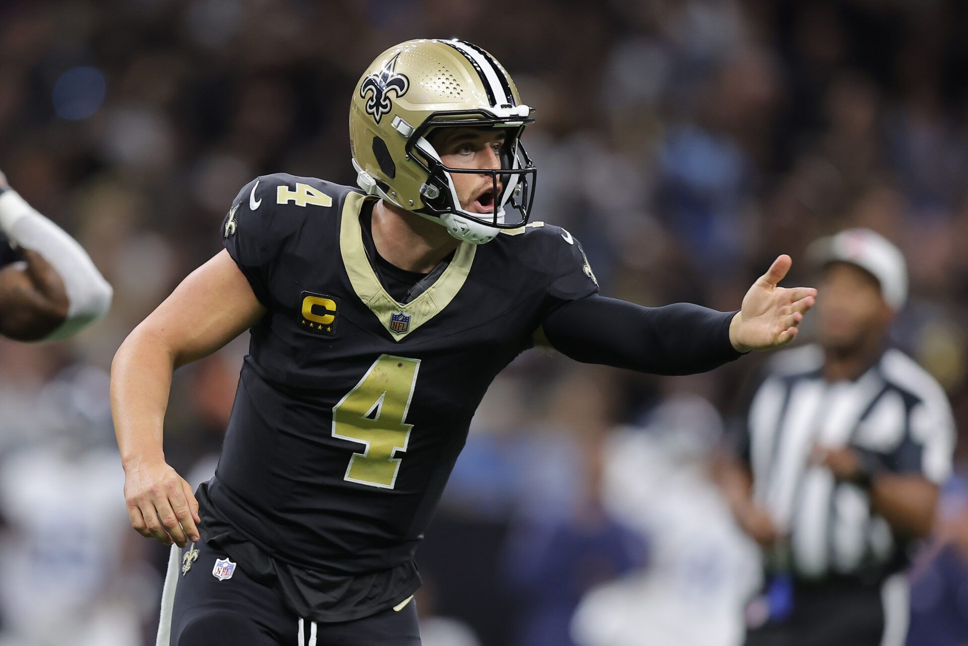 NEW ORLEANS, LOUISIANA - SEPTEMBER 10: Derek Carr #4 of the New Orleans Saints reacts for his coach to challenge a call during the second quarter against the Tennessee Titans at Caesars Superdome on September 10, 2023 in New Orleans, Louisiana. (Photo by Jonathan Bachman/Getty Images)