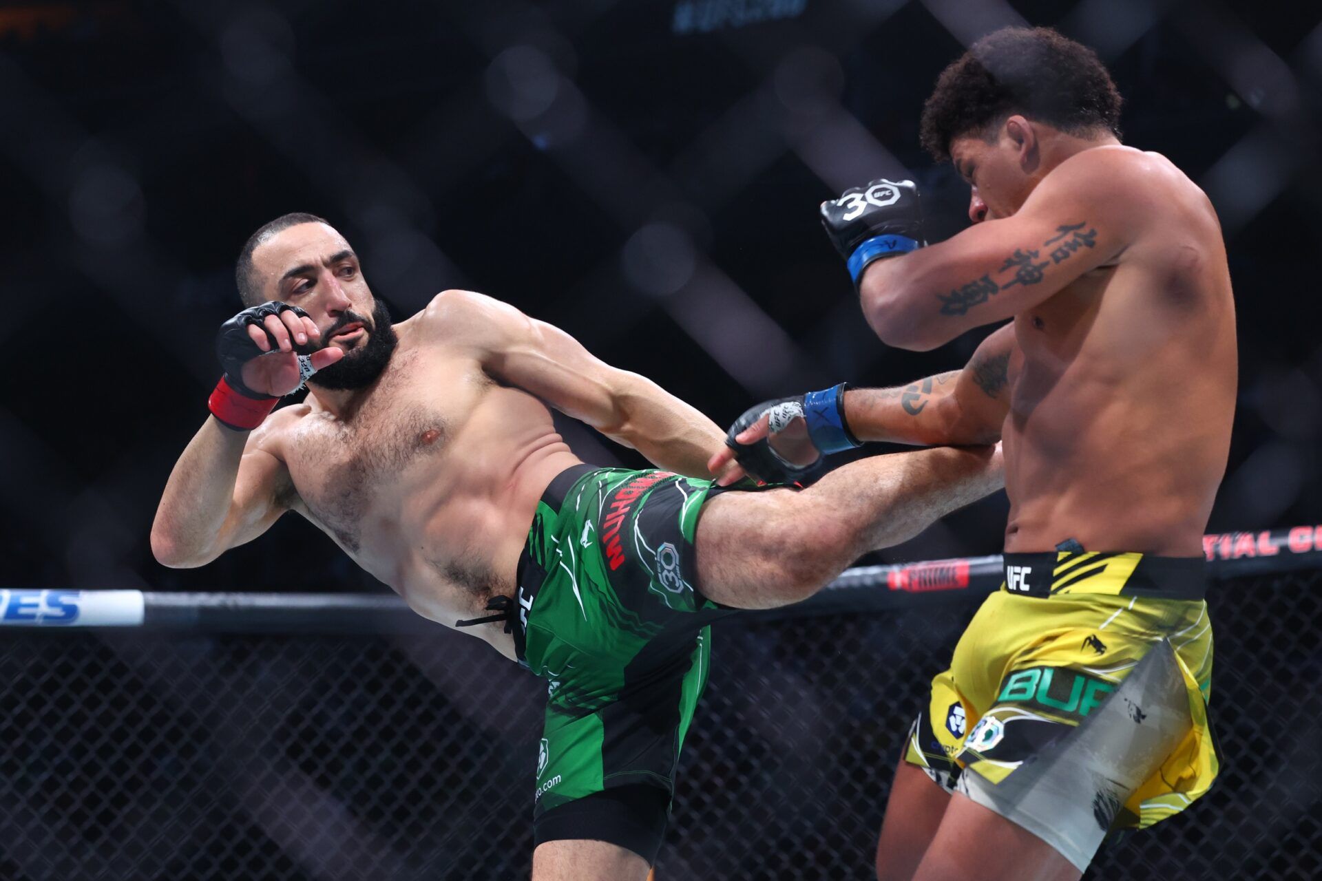 Belal Muhammad (red gloves) fights Gilbert Burns (blue gloves) during UFC 288 at Prudential Center.