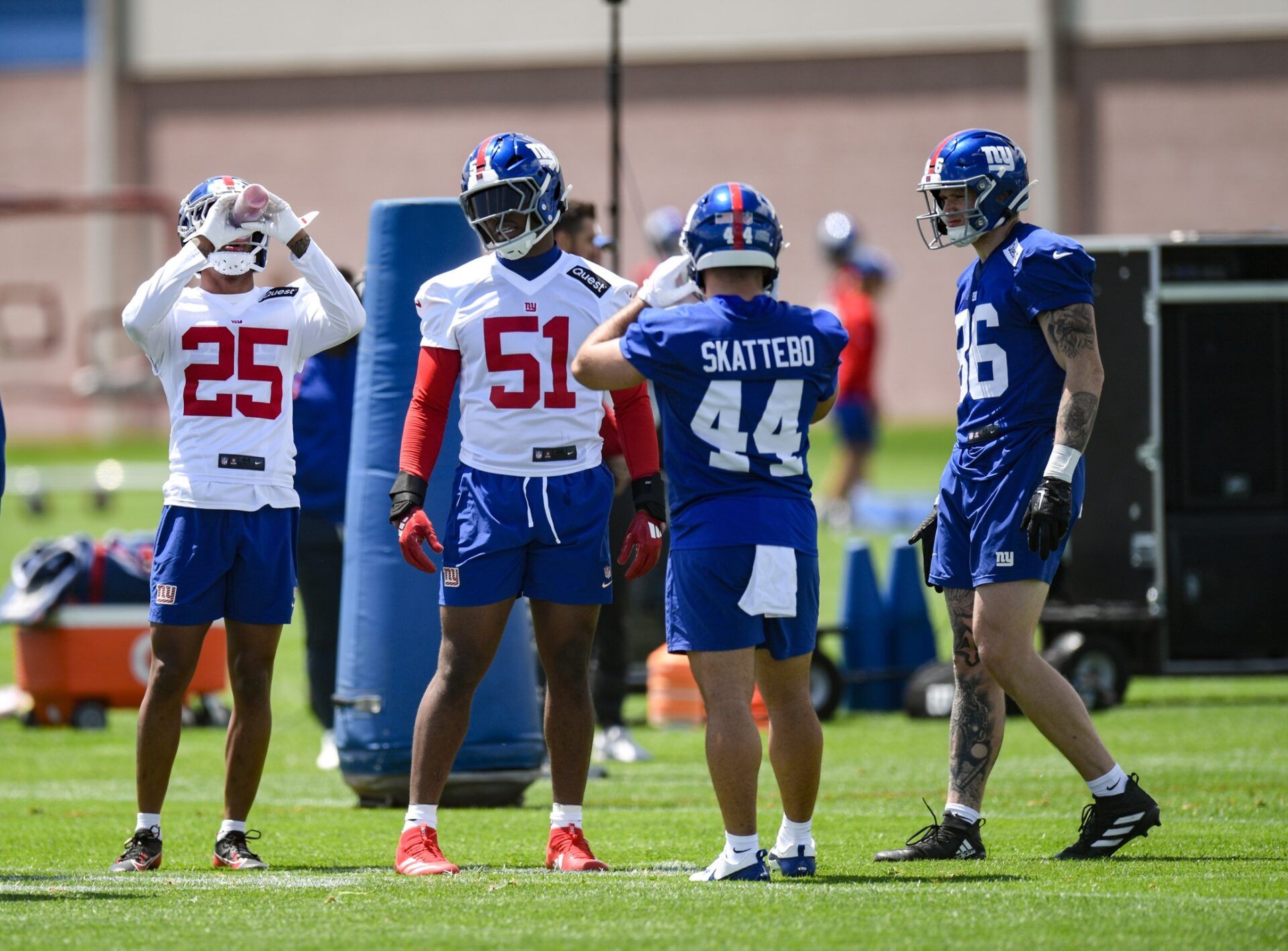 New York Giants cornerback Korie Black (25), linebacker Abdul Carter (51), running back Cam Skattebo (44) and tight end Thomas Fidone II (86) chat during rookie minicamp at Quest Diagnostics Training Center.