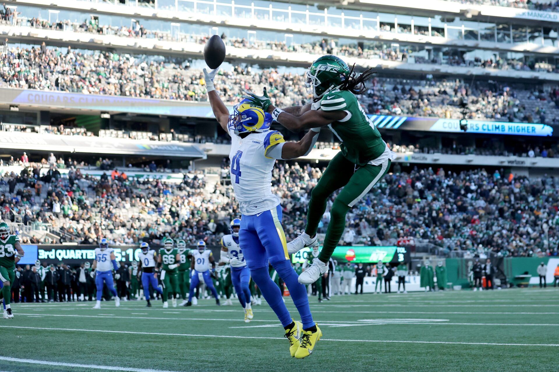 Los Angeles Rams cornerback Ahkello Witherspoon (4) breaks up a pass intended for New York Jets wide receiver Davante Adams (17) during the third quarter at MetLife Stadium.
