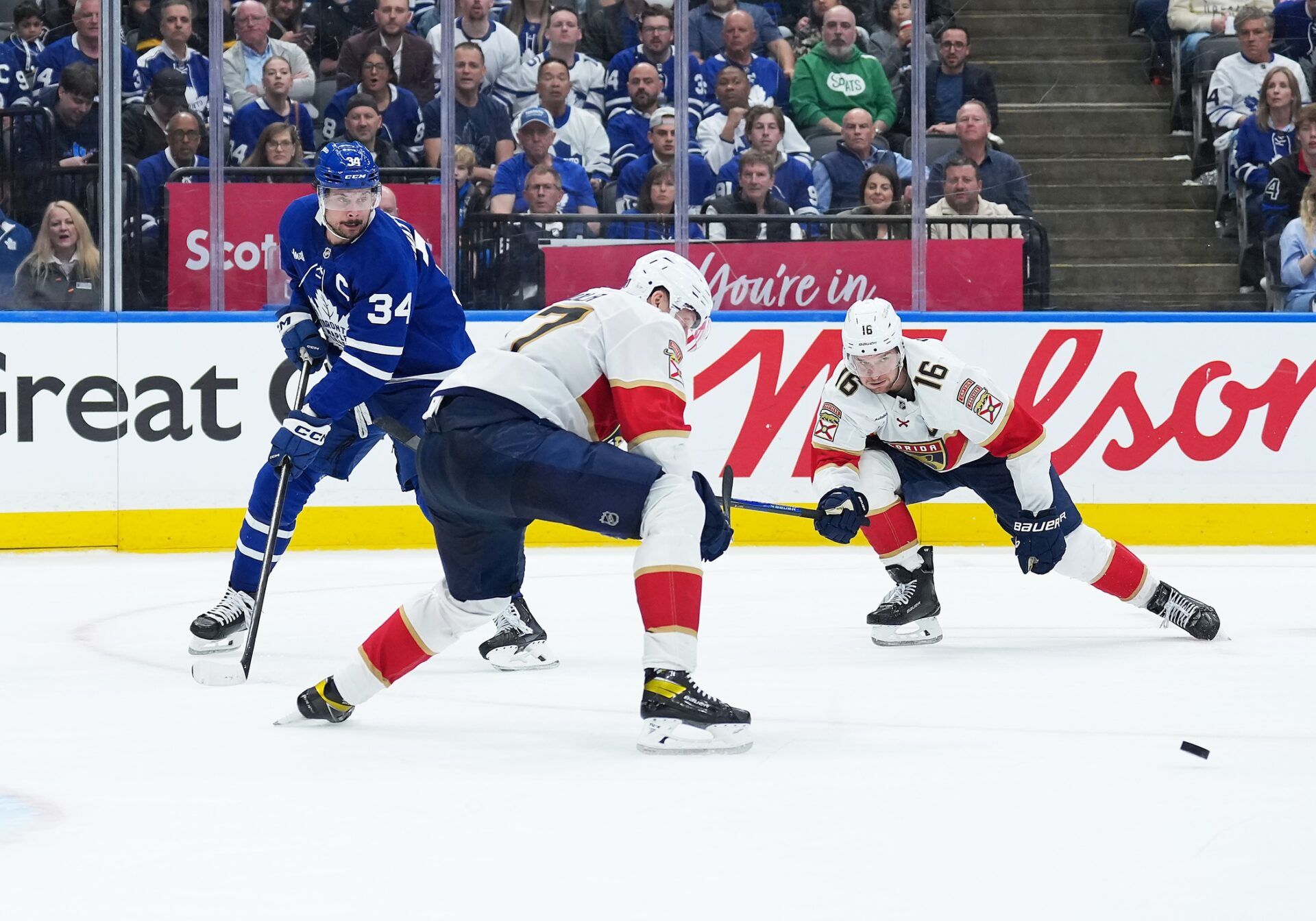 Toronto Maple Leafs center Auston Matthews (34) battles for the puck with Florida Panthers center Aleksander Barkov (16) during the third period in game two of the second round of the 2025 Stanley Cup Playoffs at Scotiabank Arena.