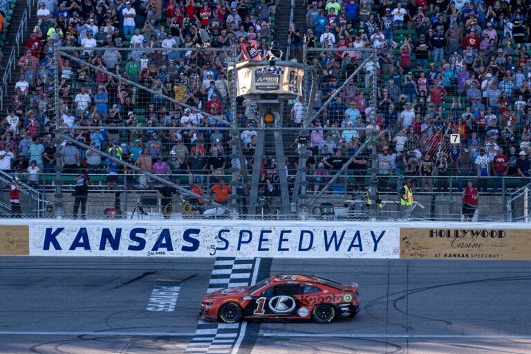 NASCAR Cup Series driver Ross Chastain (1) crosses the finish line to win the Hollywood Casino 400 at Kansas Speedway.