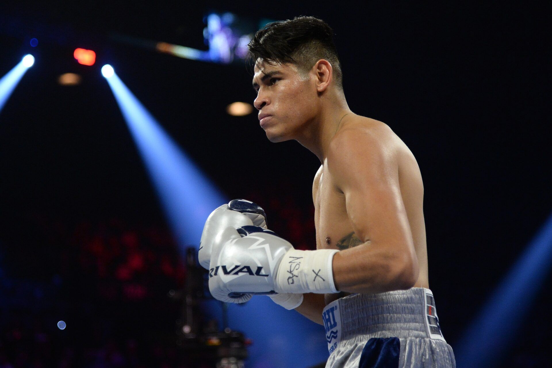 Jeo Santisima (black trunks) and Emanuel Navarrete (silver trunks) box during their WBO super bantamweight title bout at MGM Grand Garden Arena.