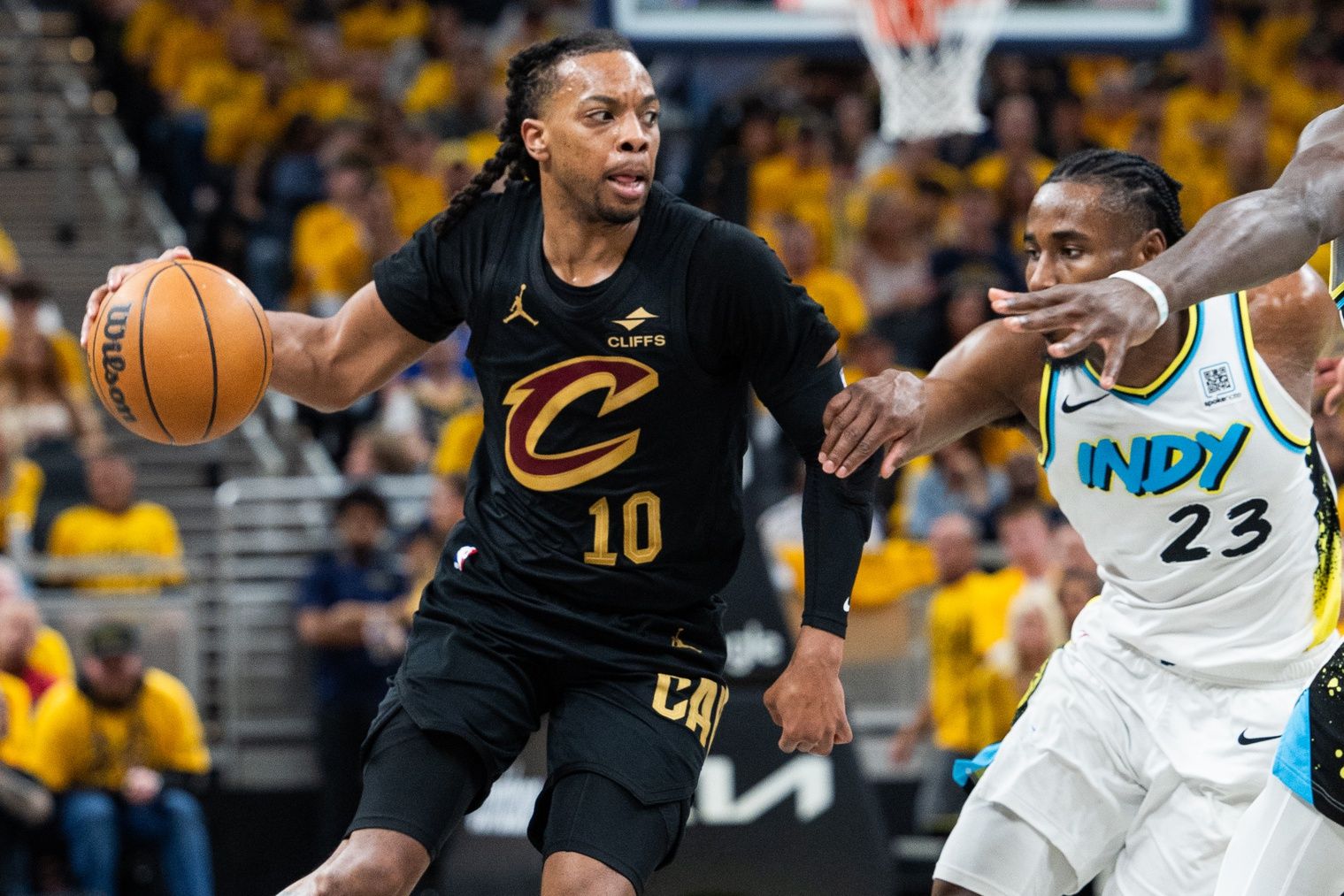 Cleveland Cavaliers guard Darius Garland (10) dribbles the ball while Indiana Pacers forward Aaron Nesmith (23) defends during game three of the second round for the 2025 NBA Playoffs at Gainbridge Fieldhouse.