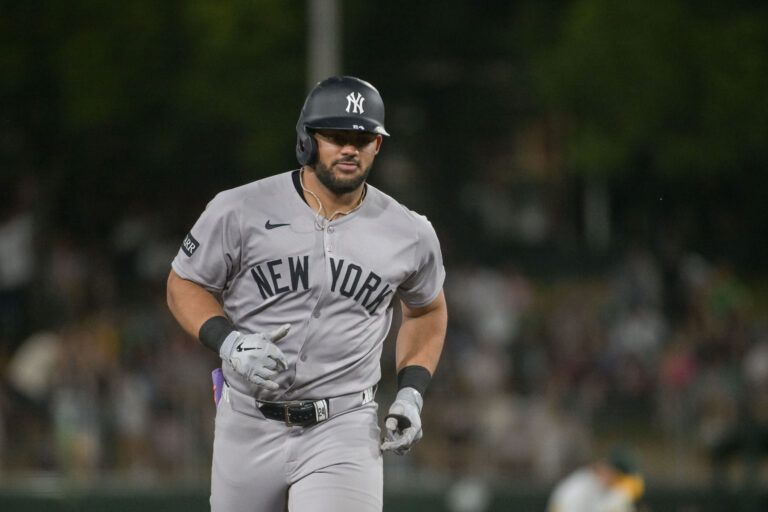 New York Yankees outfielder Jasson Dominguez (24) rounds the bases after hitting a grand slam against the Athletics during the eighth inning at Sutter Health Park.