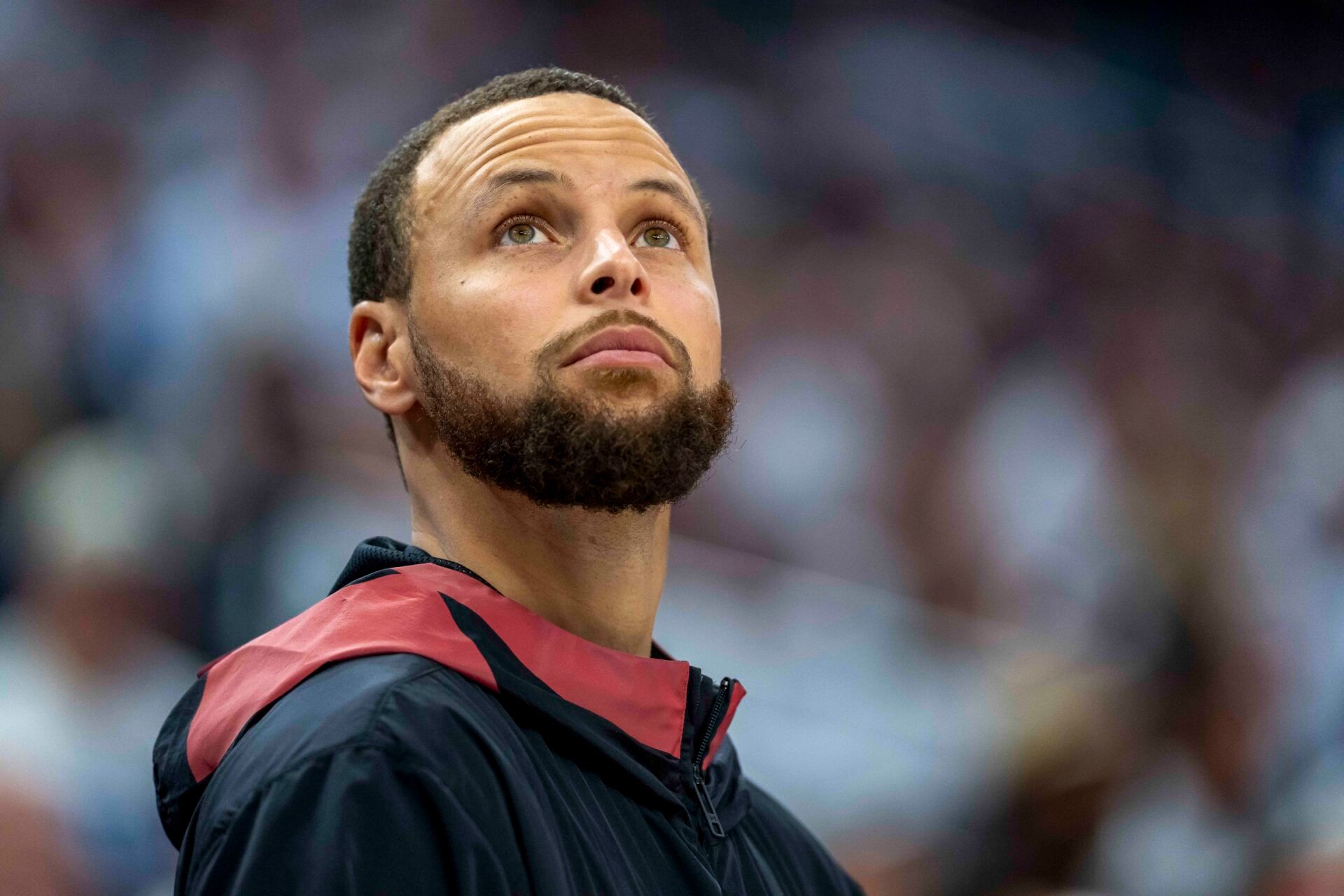 Golden State Warriors guard Stephen Curry (30) looks on from the bench against the Minnesota Timberwolves in the second half during game two of the second round for the 2025 NBA Playoffs at Target Center.