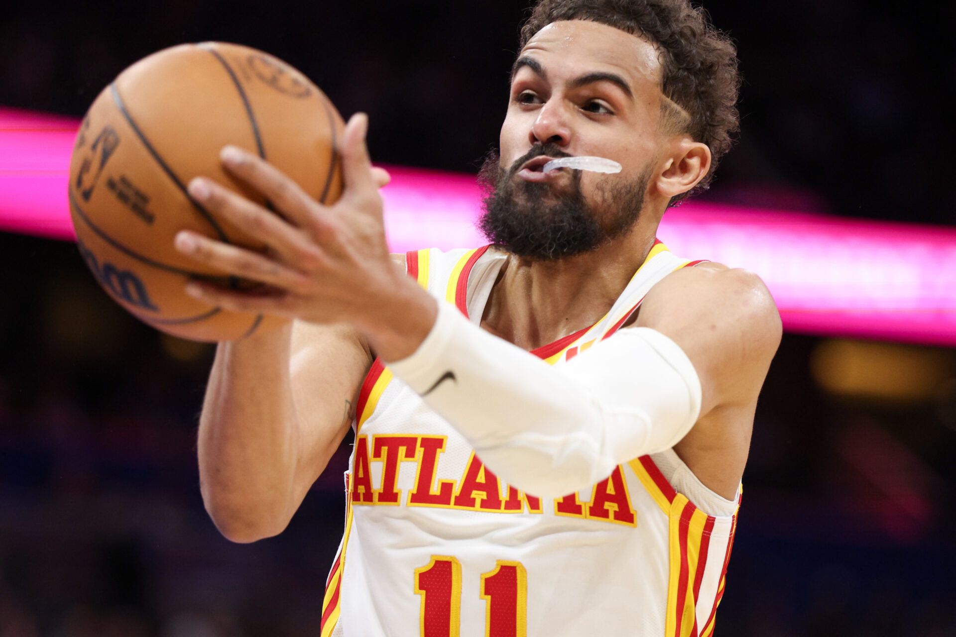 Atlanta Hawks guard Trae Young (11) rebounds the ball against the Orlando Magic in the fourth quarter at Kia Center.
