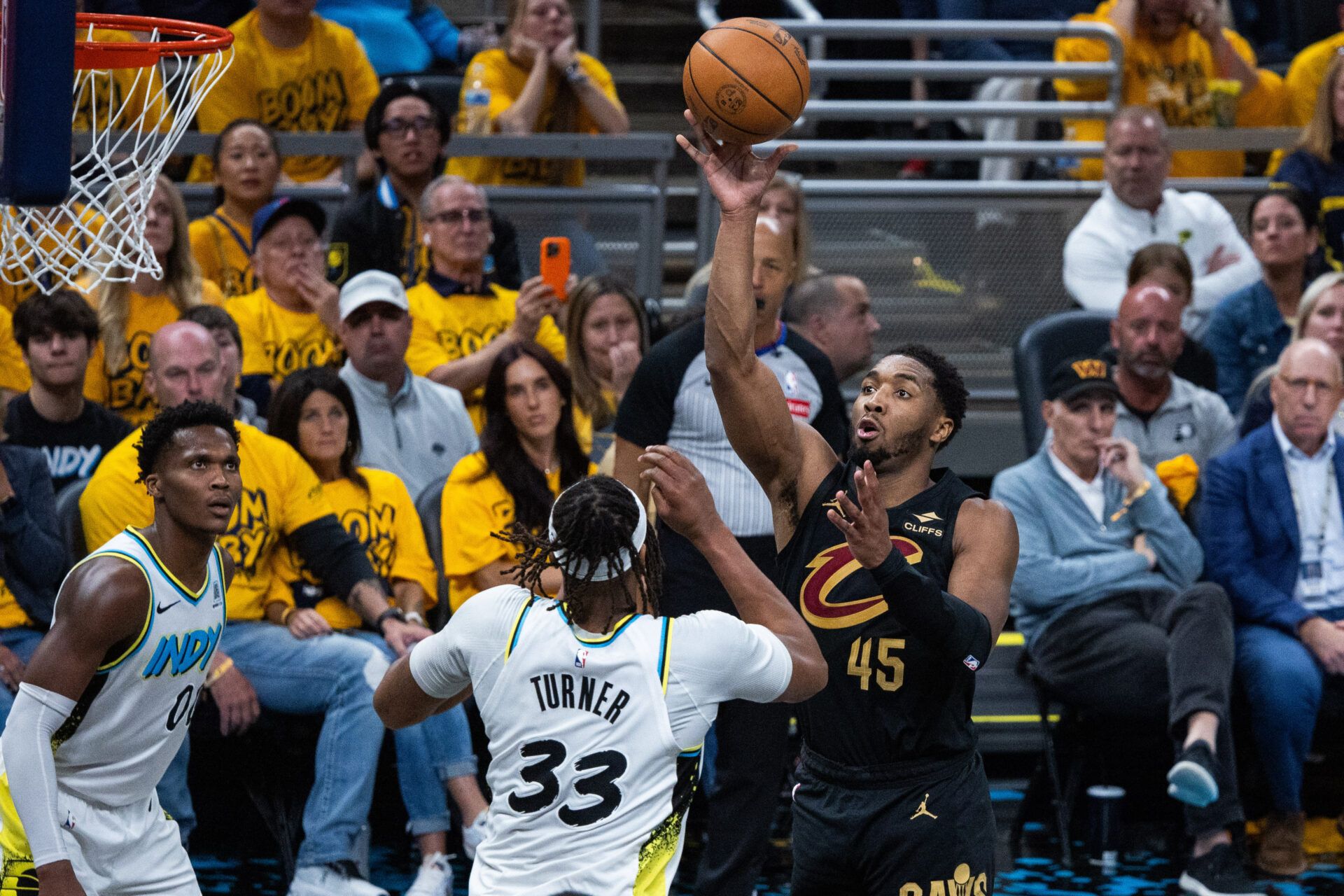 Cleveland Cavaliers guard Donovan Mitchell (45) shoots the ball while  Indiana Pacers center Myles Turner (33) defends during game three of the second round for the 2025 NBA Playoffs at Gainbridge Fieldhouse.