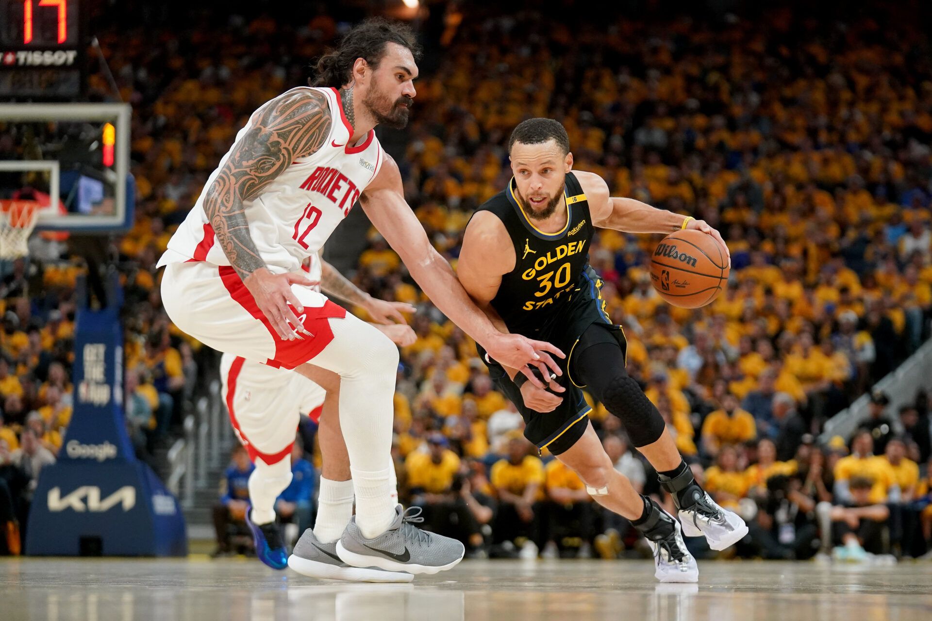 Golden State Warriors guard Stephen Curry (30) dribbles past Houston Rockets center Steven Adams (12) in the third quarter of game six of the first round for the 2025 NBA Playoffs at Chase Center.