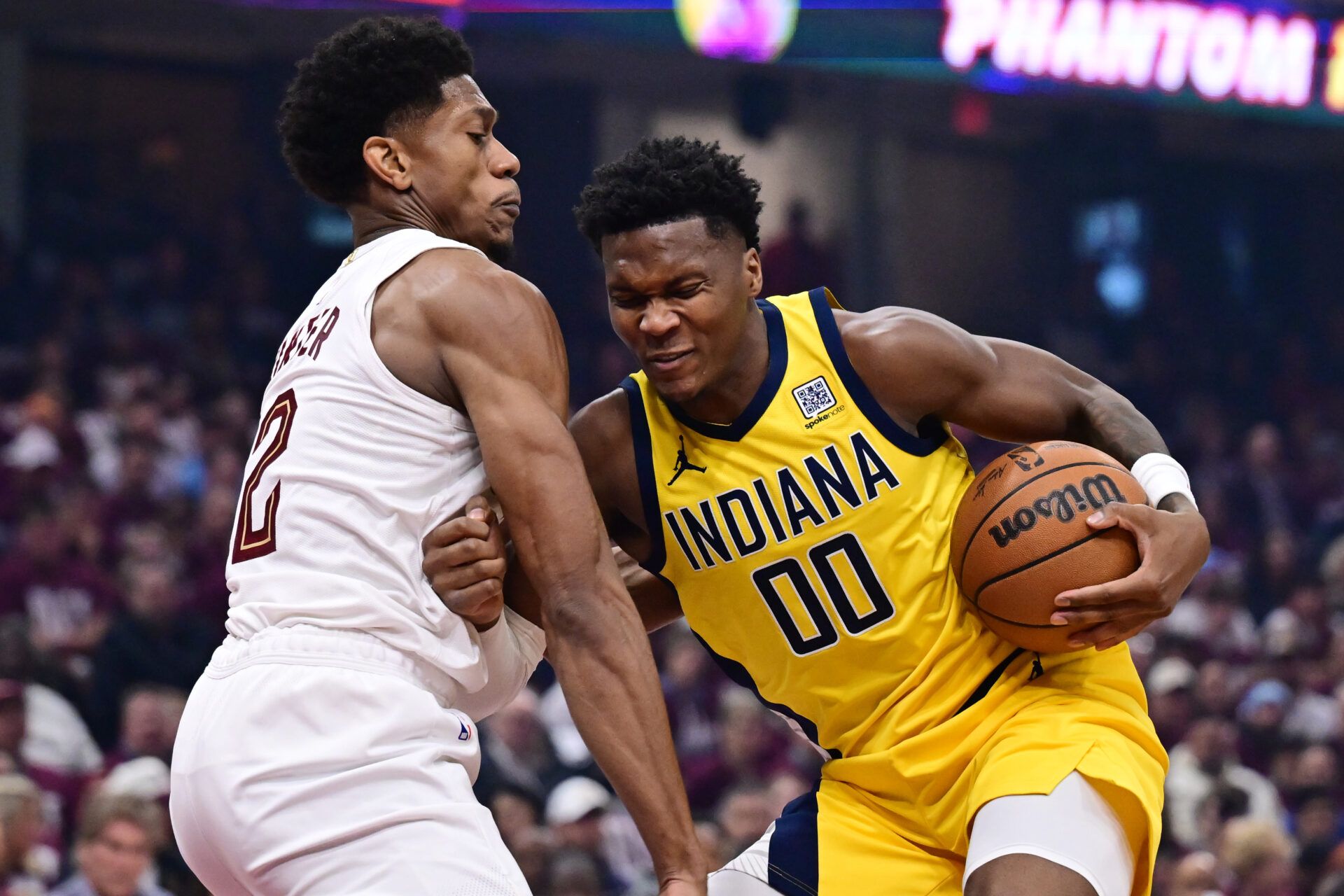 Indiana Pacers guard Bennedict Mathurin (00) drives to the basket against Cleveland Cavaliers forward De'Andre Hunter (12) during the first half in game one of the second round for the 2025 NBA Playoffs at Rocket Arena.