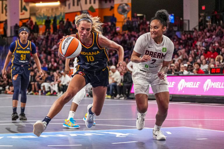 Indiana Fever guard Lexie Hull (10) tries to get to the basket past Atlanta Dream guard Te-Hina Paopao (2) during the second half at Gateway Center Arena @ College Park.
