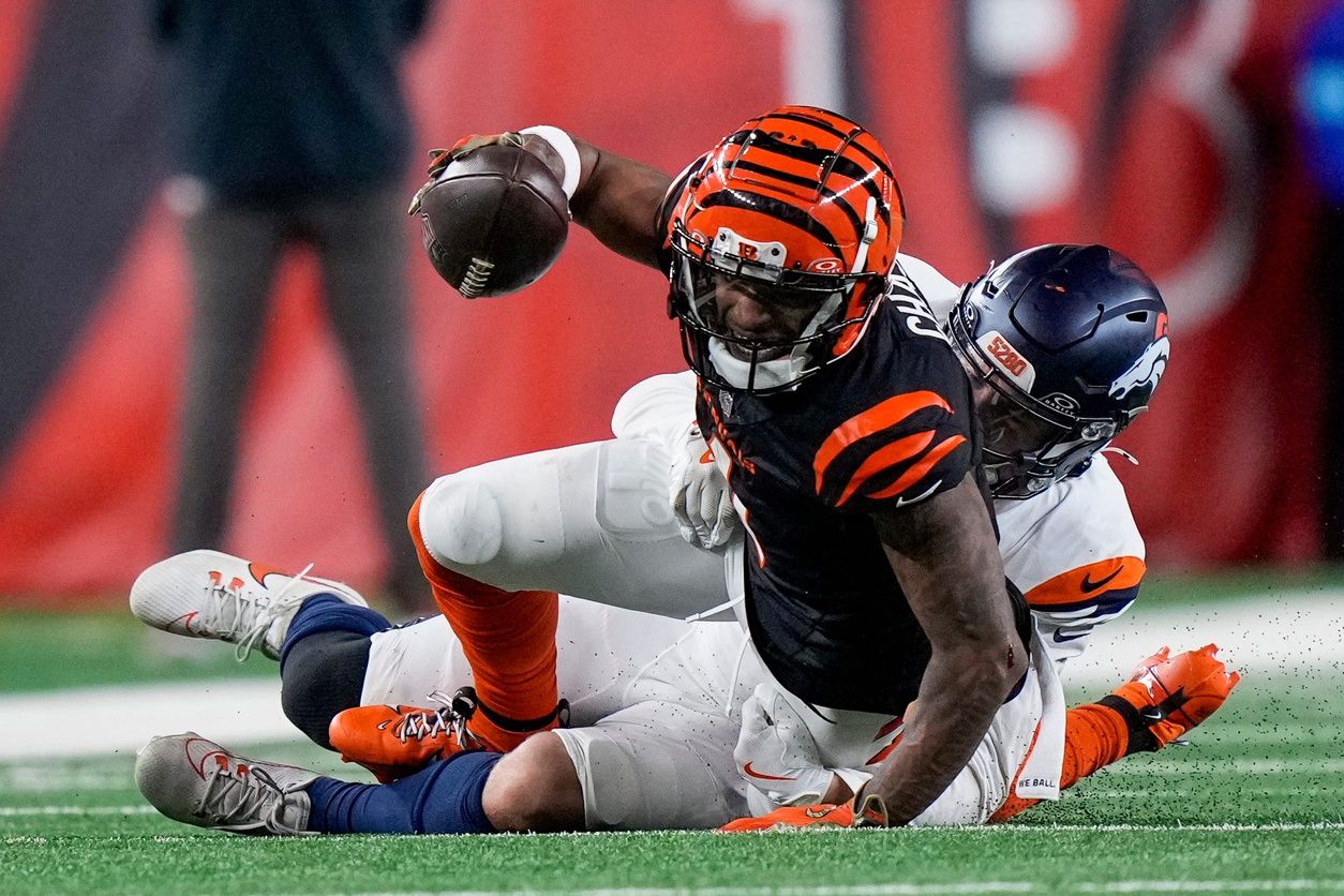 Cincinnati Bengals wide receiver Ja'Marr Chase (1) stretches as he comes down with a catch in the fourth quarter of the NFL Week 17 game between the Cincinnati Bengals and the Denver Broncos at Paycor Stadium in downtown Cincinnati on Saturday, Dec. 28, 2024. The Bengals took a 30-24 win in overtime to remain in the post season chase.

© Sam Greene/The Enquirer / USA TODAY NETWORK via Imagn Images