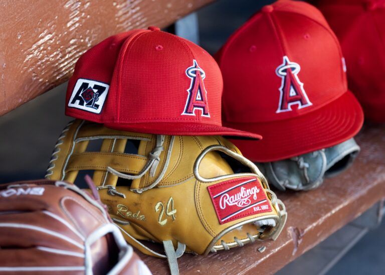 Detailed view of the Los Angeles Angels logo on a hat in the dugout during a spring training game at Camelback Ranch-Glendale.