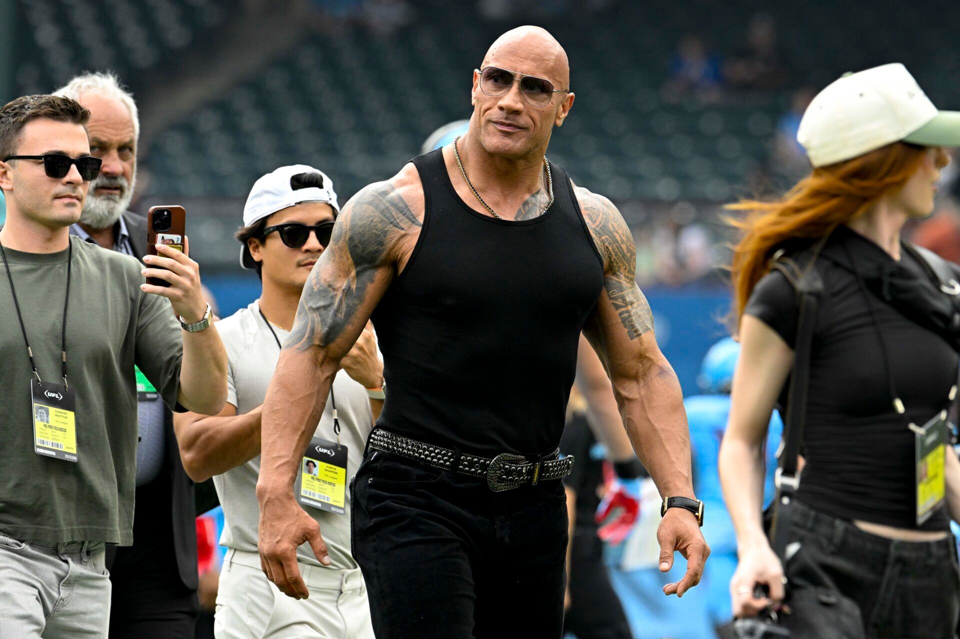 UFL owner Dwayne Johnson aka The Rock walks off the field before the game between the Arlington Renegades and the Birmingham Stallions at Choctaw Stadium.