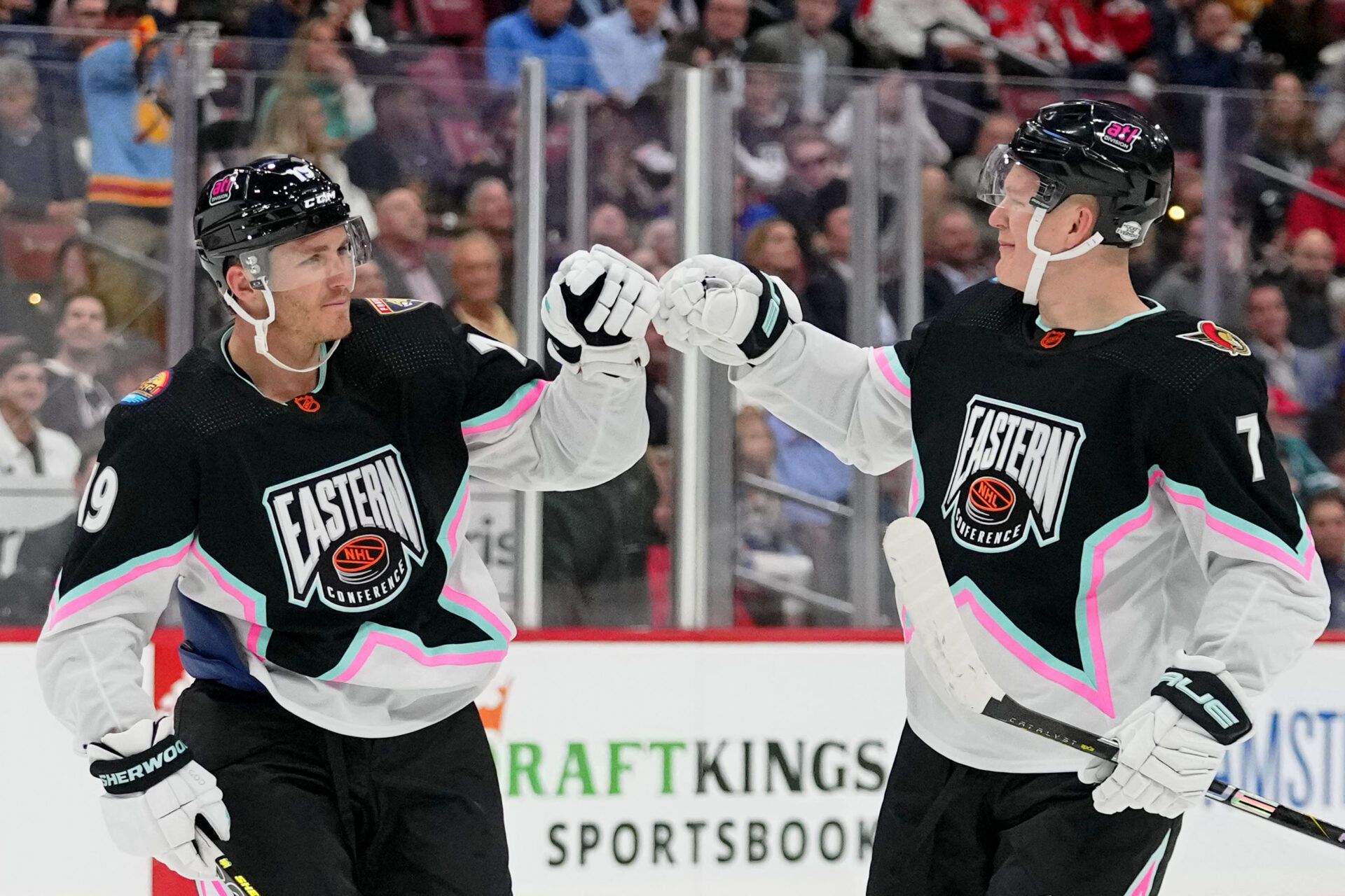 Atlantic Division forward Matthew Tkachuk (19) of the Florida Panthers fist bumps Atlantic Division forward Brady Tkachuk (71) of the Ottawa Senators during the second period of a semifinal game during the 2023 NHL All-Star Game at FLA Live Arena.