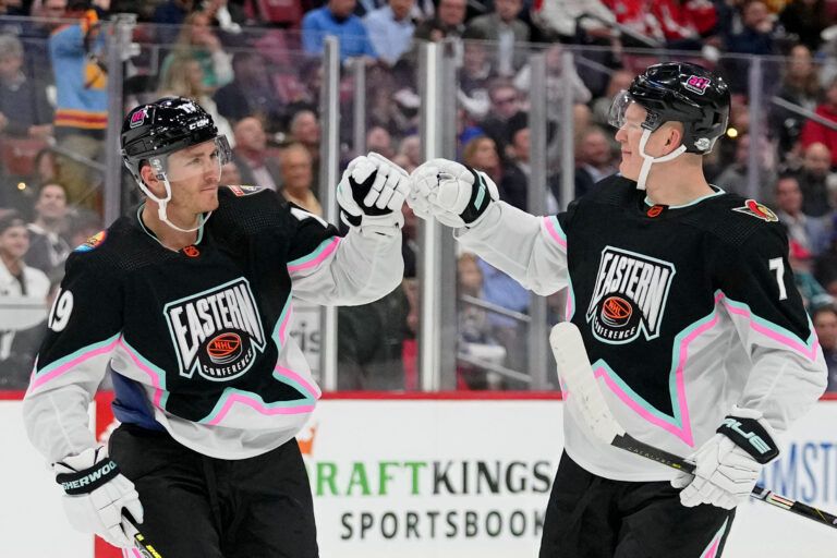Atlantic Division forward Matthew Tkachuk (19) of the Florida Panthers fist bumps Atlantic Division forward Brady Tkachuk (71) of the Ottawa Senators during the second period of a semifinal game during the 2023 NHL All-Star Game at FLA Live Arena.